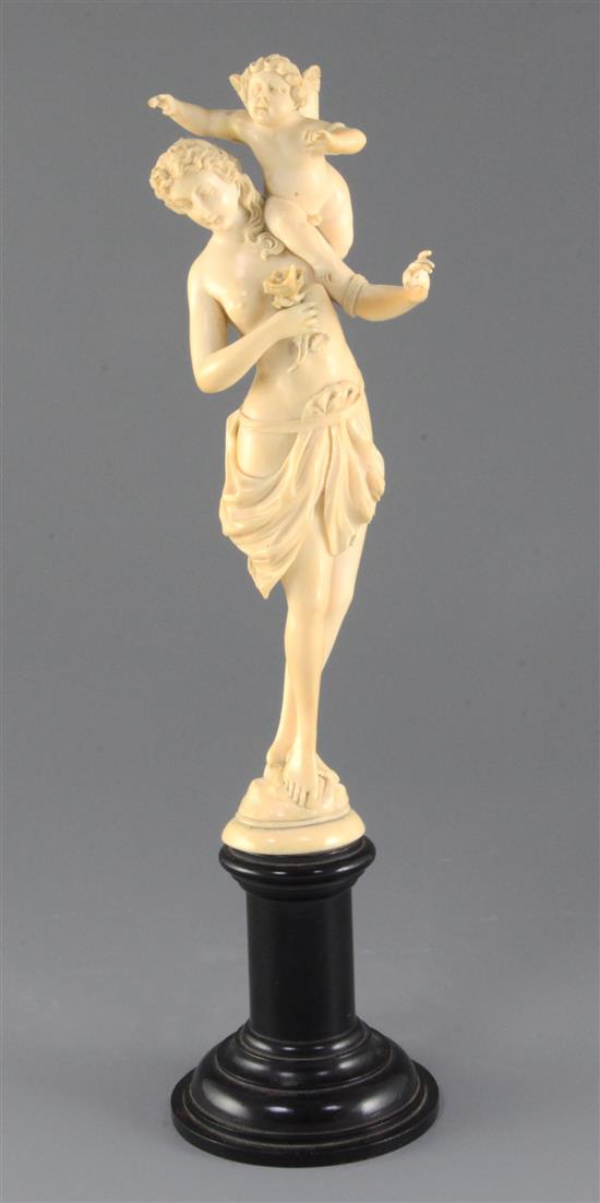 A 19th century French Dieppe ivory carving of Venus and Cupid, Overall H.13.25in.